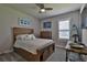 Cozy bedroom with a rustic wood bed frame and plenty of storage at 2423 Wild Turkey Creek Ln, Port Orange, FL 32128