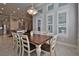 Bright dining room features a spacious table with seating for six and a view into the kitchen at 2423 Wild Turkey Creek Ln, Port Orange, FL 32128