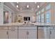 Kitchen island with granite countertop and stainless steel sink at 2423 Wild Turkey Creek Ln, Port Orange, FL 32128
