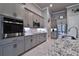 Gray kitchen cabinets, stainless steel appliances, granite counters at 2423 Wild Turkey Creek Ln, Port Orange, FL 32128
