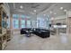 Open living area with large windows, high ceilings, and a modern kitchen at 2423 Wild Turkey Creek Ln, Port Orange, FL 32128