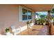 Covered porch with tiled flooring and potted plants at 25 Valhalla Ave, Ormond Beach, FL 32176