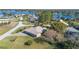 Aerial view of a house and surrounding area, showing a peaceful lakeside neighborhood at 2501 Alton Rd, Deltona, FL 32738