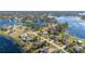Aerial view of a lakefront neighborhood, showcasing homes near the water at 2501 Alton Rd, Deltona, FL 32738