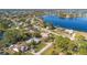 Aerial view of residential neighborhood, featuring homes situated near a lake at 2501 Alton Rd, Deltona, FL 32738