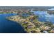 Aerial view of lakefront community, showing the neighborhood's layout and water access at 2501 Alton Rd, Deltona, FL 32738