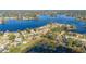 Aerial view of homes near a lake, showcasing waterfront properties and surrounding landscape at 2501 Alton Rd, Deltona, FL 32738