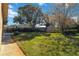 Side yard with shed and spacious grassy area at 2501 Alton Rd, Deltona, FL 32738