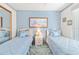 Bedroom with twin beds and light blue bedding at 2501 Alton Rd, Deltona, FL 32738