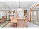 Bright dining room features a large table and chandelier at 2501 Alton Rd, Deltona, FL 32738