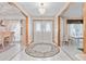 Elegant entryway with double doors and a circular rug at 2501 Alton Rd, Deltona, FL 32738