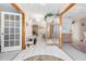 Bright and spacious entryway with tile floors and mirrored walls at 2501 Alton Rd, Deltona, FL 32738