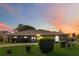 Brick ranch home with landscaped lawn at sunset at 2501 Alton Rd, Deltona, FL 32738