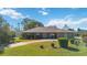 Ranch style home with mature landscaping and driveway at 2501 Alton Rd, Deltona, FL 32738