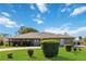 Brick ranch house with landscaped lawn and circular driveway at 2501 Alton Rd, Deltona, FL 32738