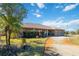 Ranch house with landscaping and a long driveway at 2501 Alton Rd, Deltona, FL 32738