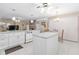Eat-in kitchen, granite counters, island, and white cabinets at 2501 Alton Rd, Deltona, FL 32738