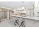 Kitchen with island, granite countertops, and white cabinets at 2501 Alton Rd, Deltona, FL 32738