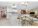 Large kitchen with island, white cabinets and granite at 2501 Alton Rd, Deltona, FL 32738