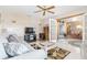 Comfortable living room with French doors and view to dining area at 2501 Alton Rd, Deltona, FL 32738