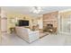 Relaxing living room with brick fireplace and tiled floors at 2501 Alton Rd, Deltona, FL 32738