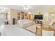 Open living room with tiled floors and built-in shelving at 2501 Alton Rd, Deltona, FL 32738
