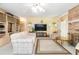 Spacious living room features a fireplace and built-in shelving at 2501 Alton Rd, Deltona, FL 32738