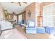 Spacious sunroom with brick walls and seating area at 2501 Alton Rd, Deltona, FL 32738
