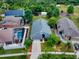 Aerial view shows house, pool, and surrounding neighborhood at 2911 Wild Pepper Ave, Deltona, FL 32725