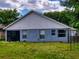 Home's backyard with screened patio at 2911 Wild Pepper Ave, Deltona, FL 32725