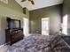 Primary bedroom with ensuite bathroom and large bed at 2911 Wild Pepper Ave, Deltona, FL 32725