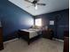 Cozy bedroom with dark blue walls and a double bed at 2911 Wild Pepper Ave, Deltona, FL 32725