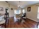 Bright dining room with hardwood floors and a glass table at 2911 Wild Pepper Ave, Deltona, FL 32725