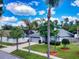 House exterior features a two-car garage and manicured lawn at 2911 Wild Pepper Ave, Deltona, FL 32725