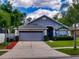 Two-car garage and manicured lawn at 2911 Wild Pepper Ave, Deltona, FL 32725