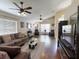 Spacious living room with hardwood floors and comfy seating at 2911 Wild Pepper Ave, Deltona, FL 32725