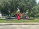 A colorful playground is nestled in a well-maintained green space at 2911 Wild Pepper Ave, Deltona, FL 32725