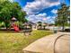Community playground near pool and clubhouse at 2911 Wild Pepper Ave, Deltona, FL 32725