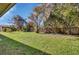Spacious backyard with a wooden fence and shed at 2994 Annez Way, Debary, FL 32713