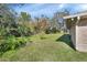 Large backyard with mature trees and grassy lawn at 2994 Annez Way, Debary, FL 32713