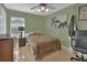 Comfortable bedroom with a double bed and ceiling fan at 2994 Annez Way, Debary, FL 32713
