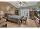 Spacious bedroom with a king-size bed and a ceiling fan at 2994 Annez Way, Debary, FL 32713