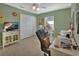 Bright bedroom featuring a desk and ample closet space at 2994 Annez Way, Debary, FL 32713