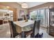 Dining room with four chairs, globe, and view into living room at 2994 Annez Way, Debary, FL 32713