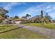 Home with a long driveway and established landscaping at 2994 Annez Way, Debary, FL 32713