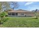 Brick house with a large backyard and screened porch at 2994 Annez Way, Debary, FL 32713