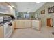 Open kitchen with stainless steel appliances and breakfast bar at 2994 Annez Way, Debary, FL 32713