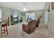 Living room with two brown recliners and a large TV at 2994 Annez Way, Debary, FL 32713