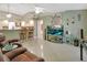 Living room with kitchen bar, TV, and recliners at 2994 Annez Way, Debary, FL 32713