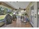 Relaxing screened porch with patio furniture and yard views at 2994 Annez Way, Debary, FL 32713